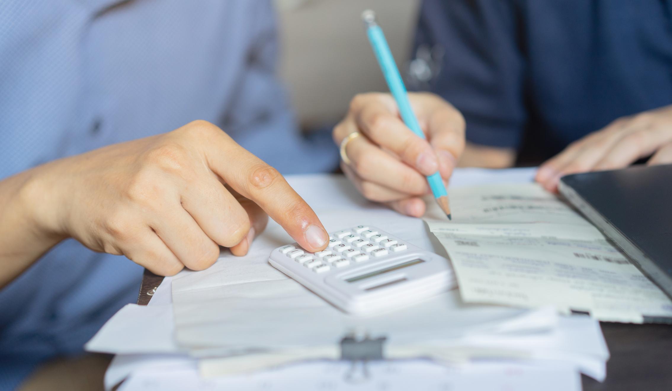 A couple reviewing their mortgage paperwork and financial statements.
