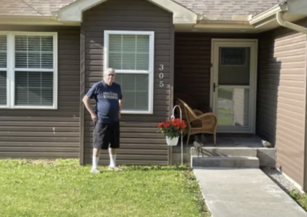 picture of Steven S. in front of a house