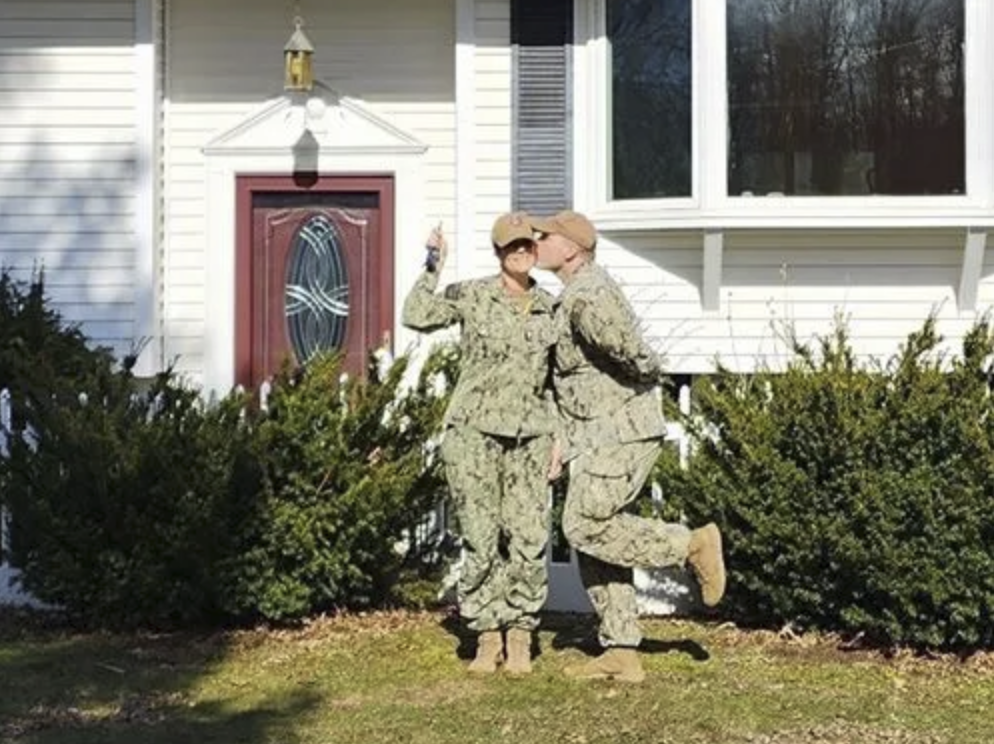 picture of Michelle M. in front of a house