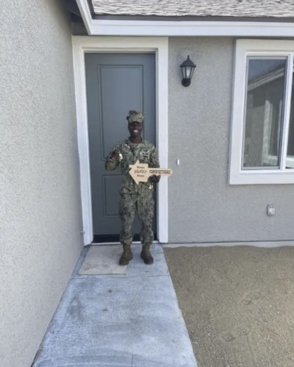 picture of Jonathan K. in front of a house