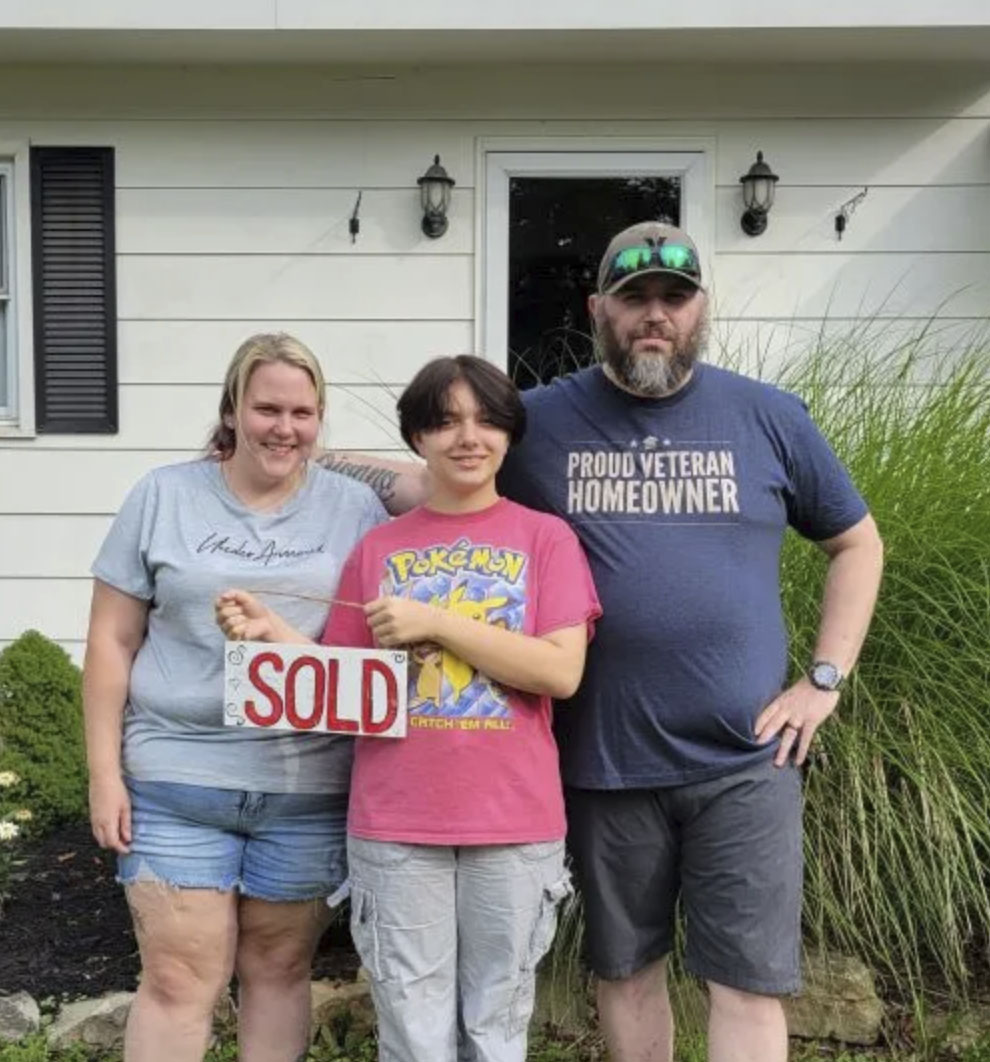 picture of Donova B. in front of a house