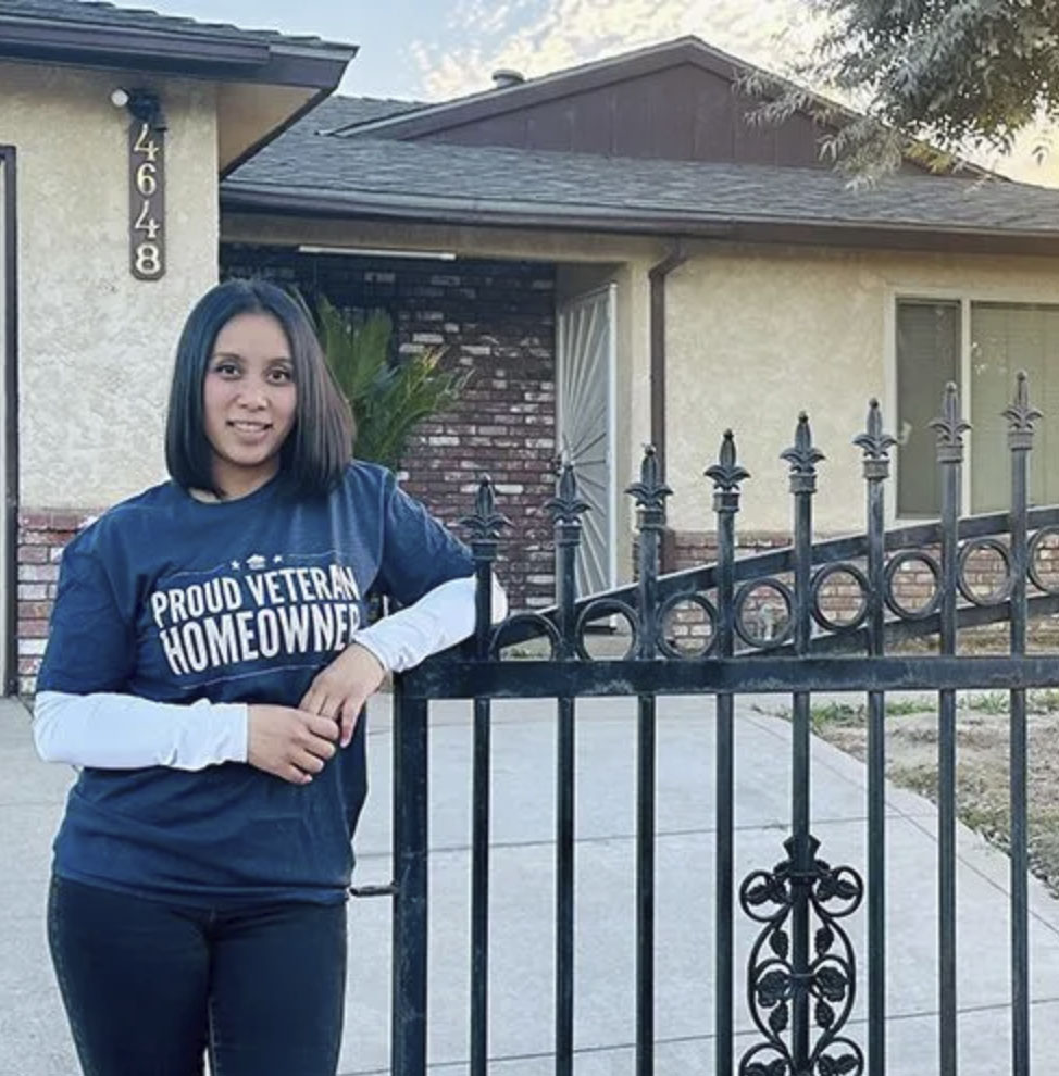 picture of Aleeta R. in front of a house