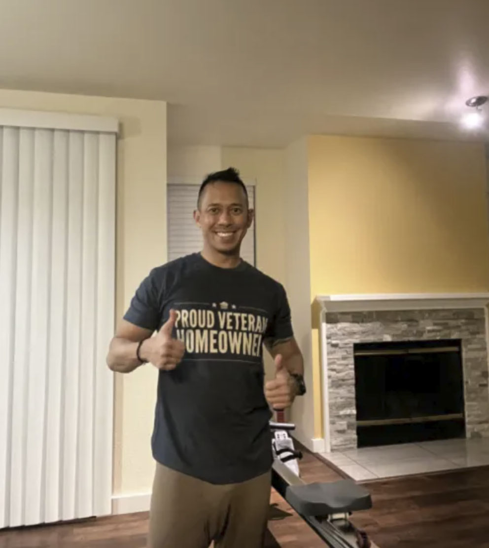 picture of Romulo U. in front of a house